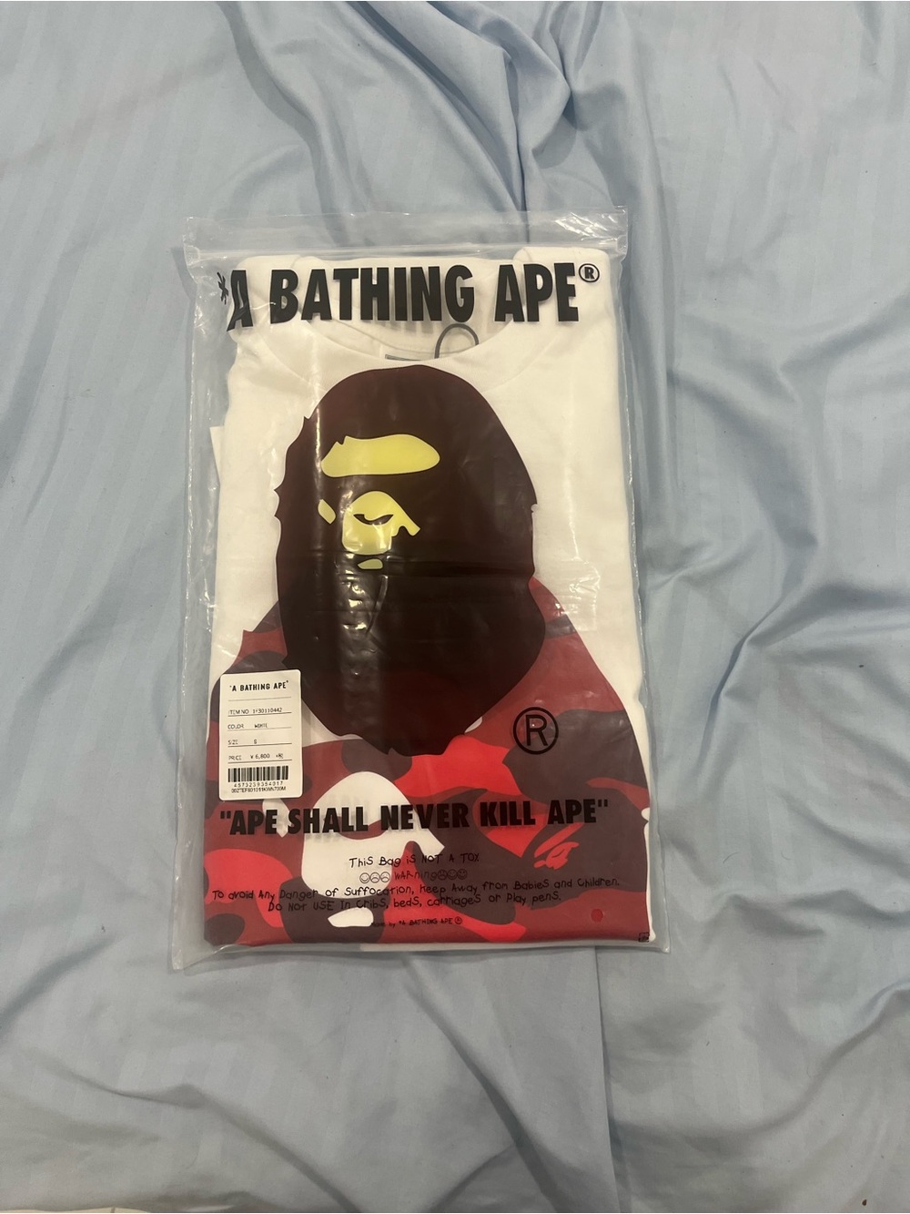 Bape White Short Sleeve Tee with Red Camo Ape Head